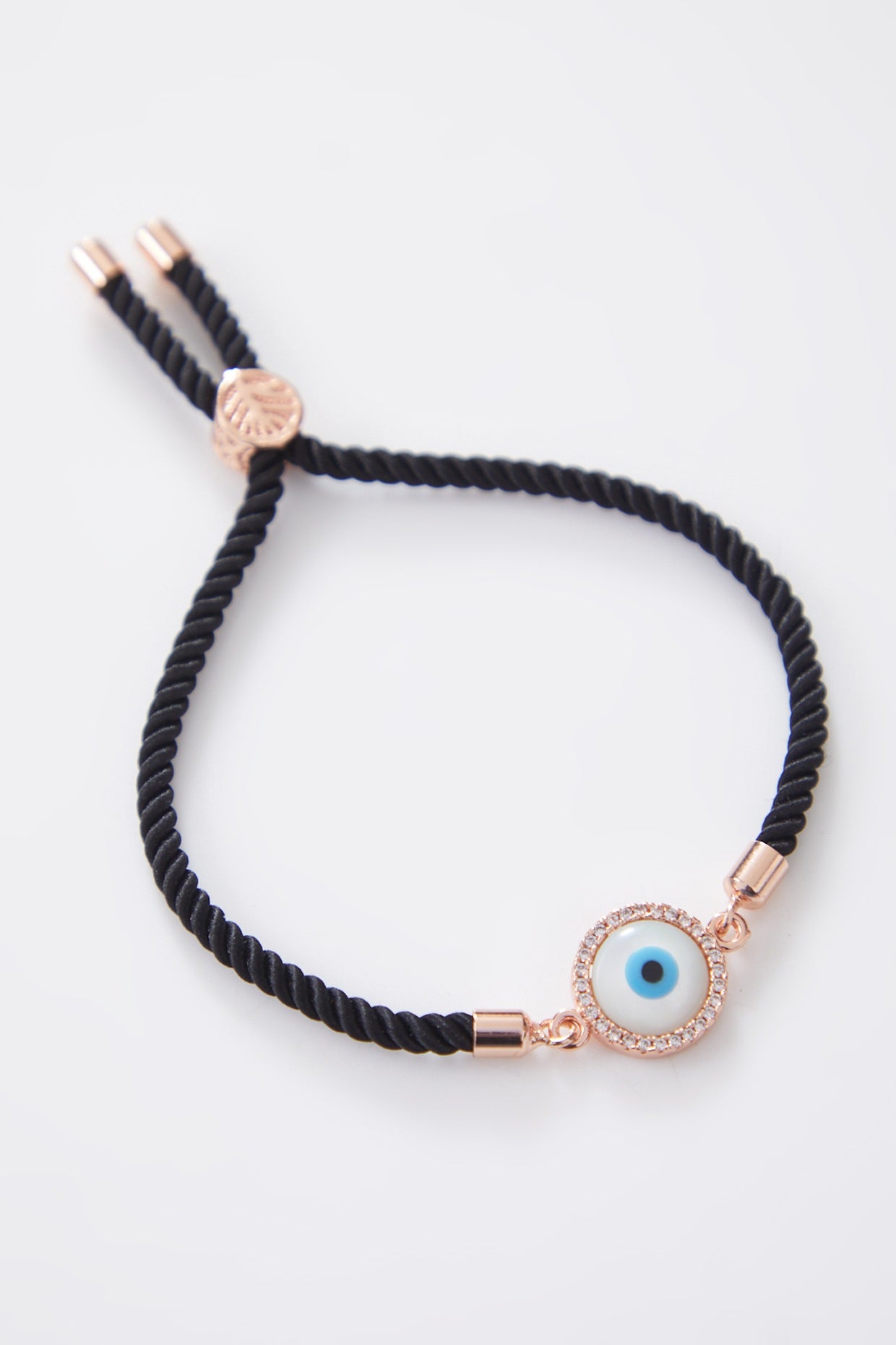 Round Rose Gold Pearl Evil Eye Rakhi With Adjustable String