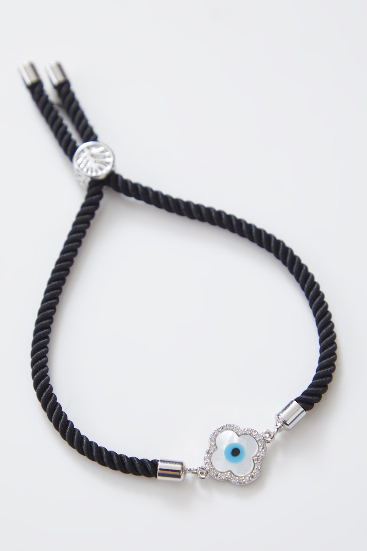 Delicate Mother of Pearl Silver Evil Eye Rakhi With Adjustable String