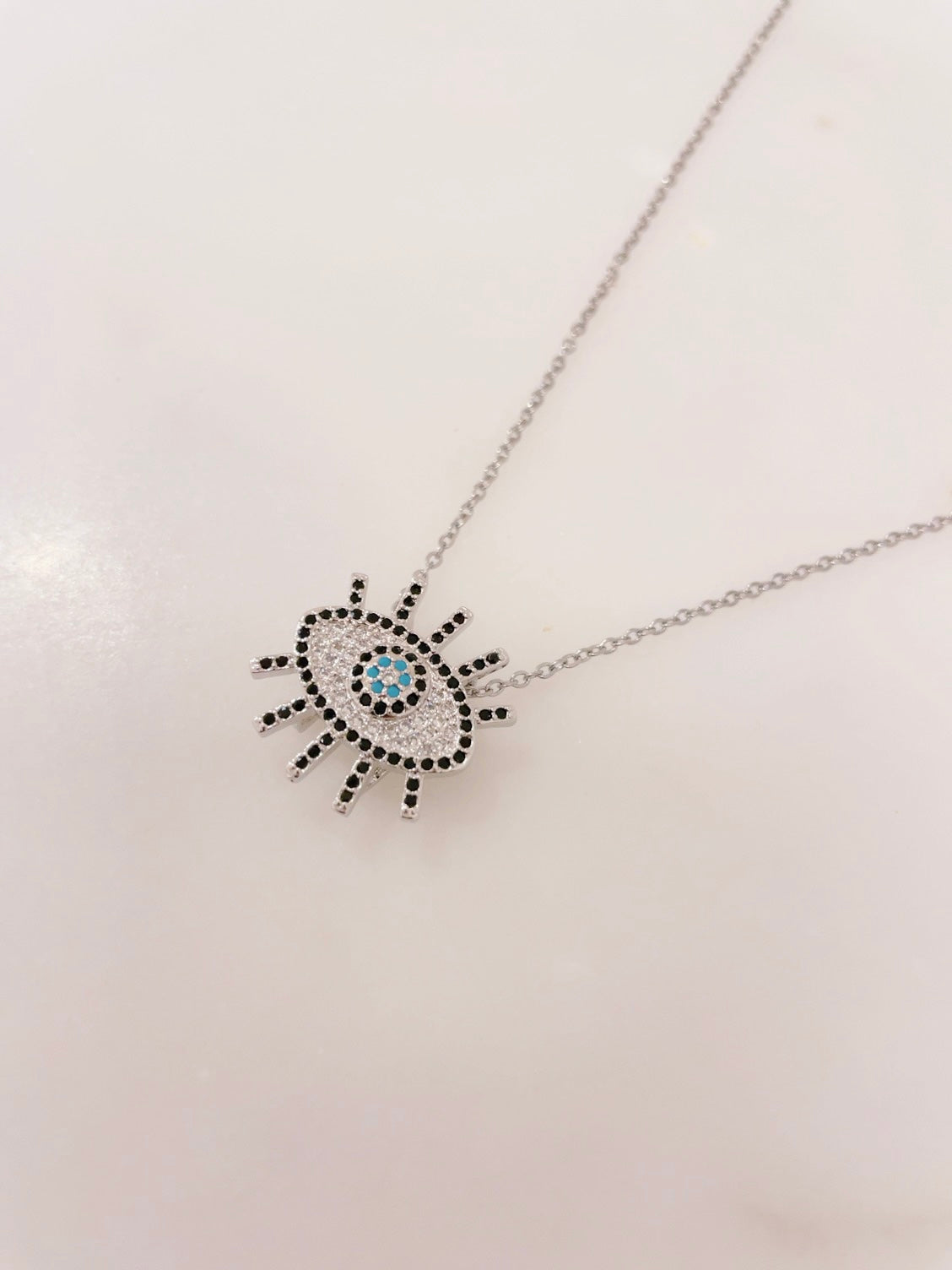 Ikasiya Silver Turq Crystal Studded Evil Eye Necklace