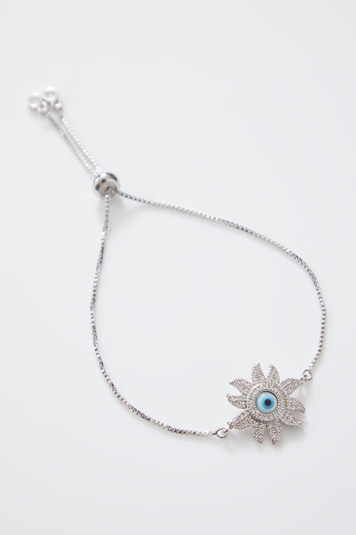 Silver Flower Pearl Evil Eye Rakhi With Adjustable Silver String