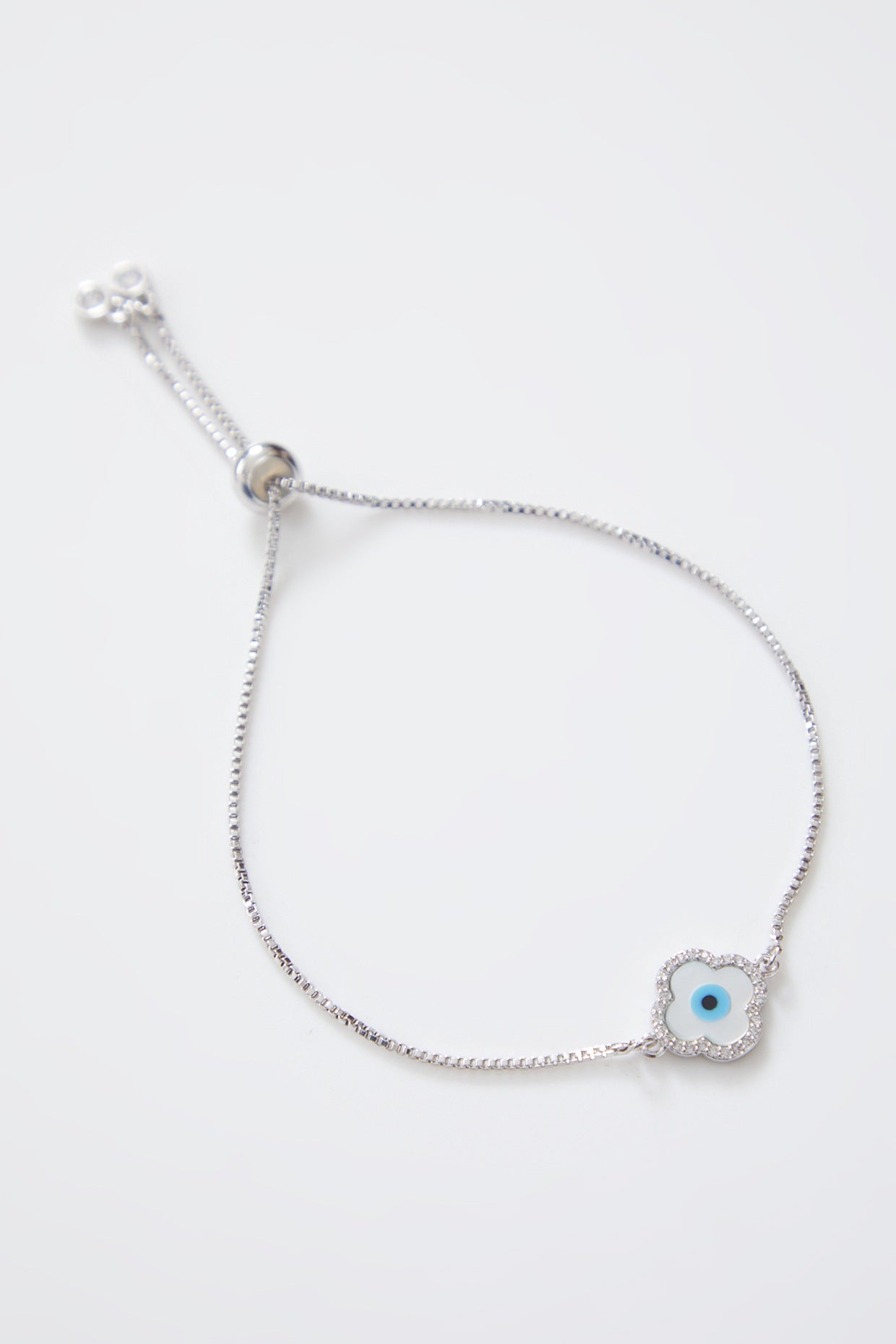 Delicate Mother of Pearl Silver Evil Eye Rakhi With Silver Adjustable String
