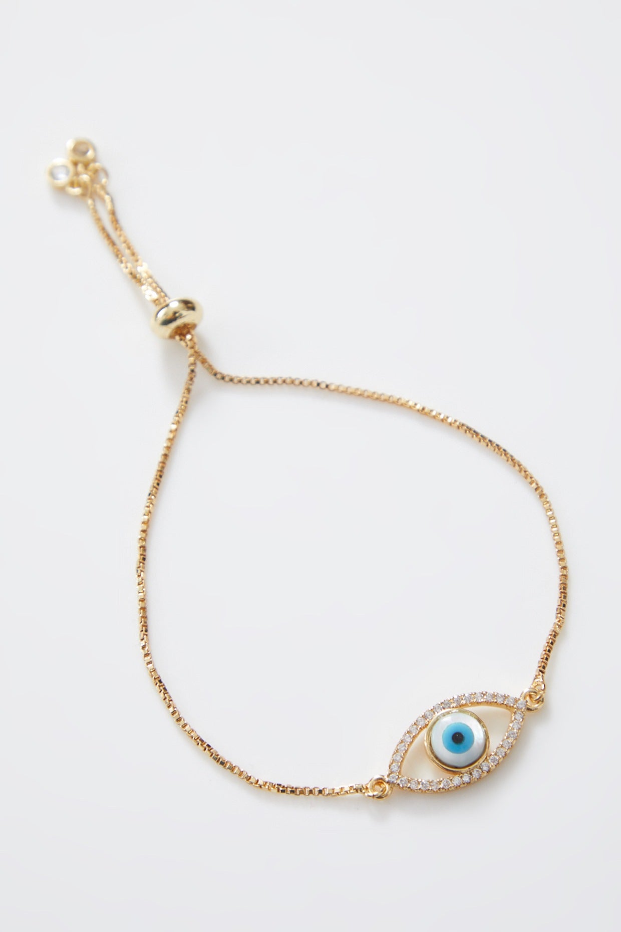 Classic Gold Pearl Evil Eye Rakhi With Gold Adjustable String