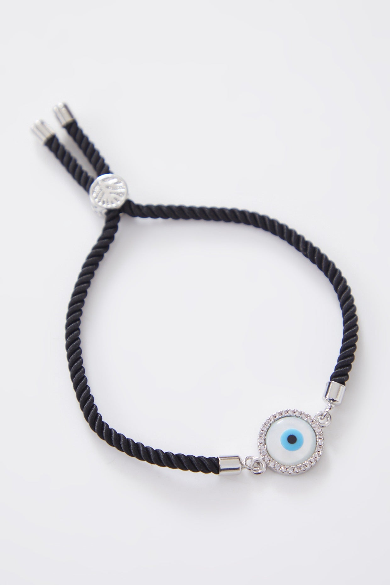 Round Silver Pearl Evil Eye Rakhi With Adjustable String
