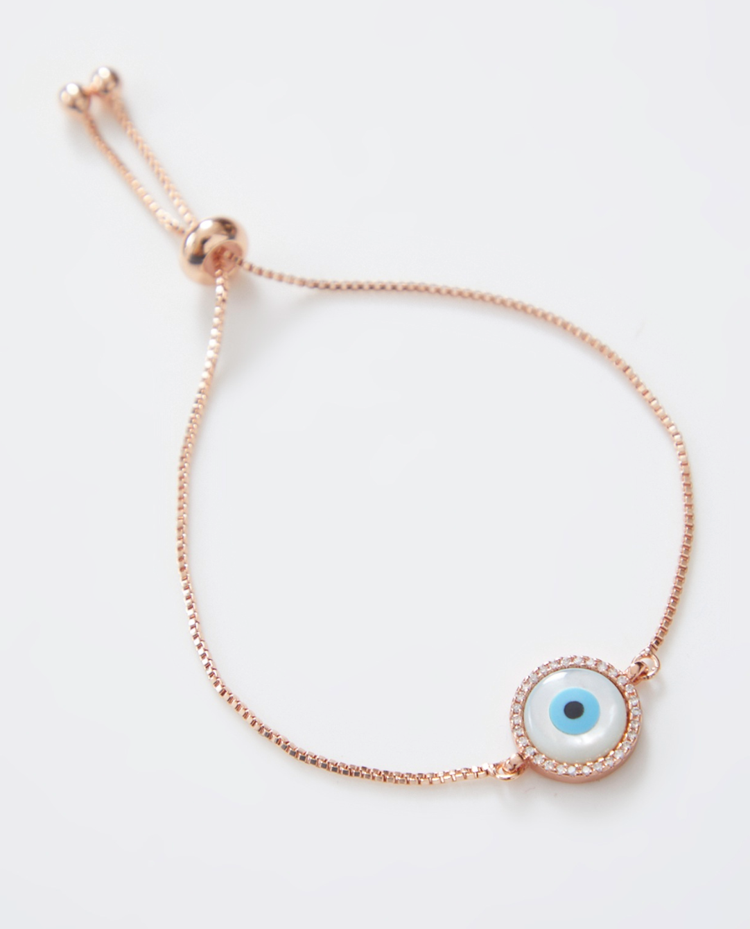 Round Rose Gold Pearl Evil Eye Rakhi With Gold Adjustable String