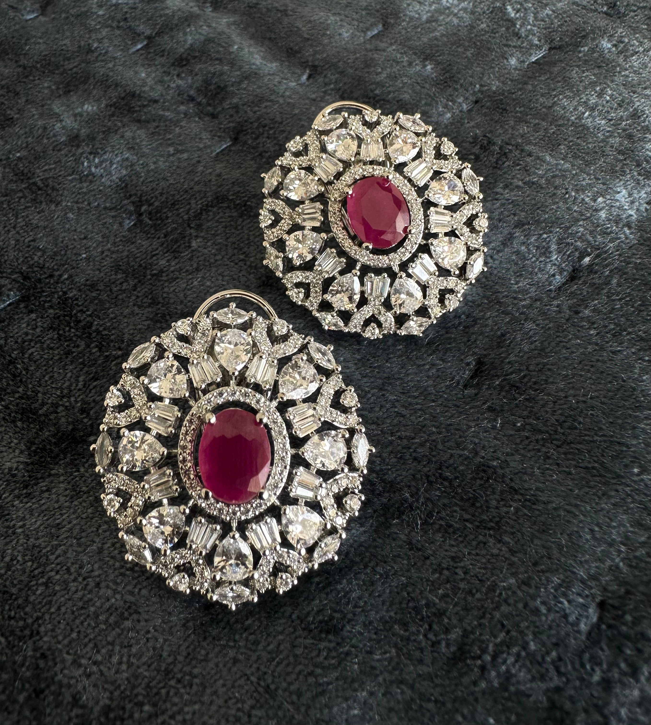 White Diamonds With Red Stone Stud Earrings