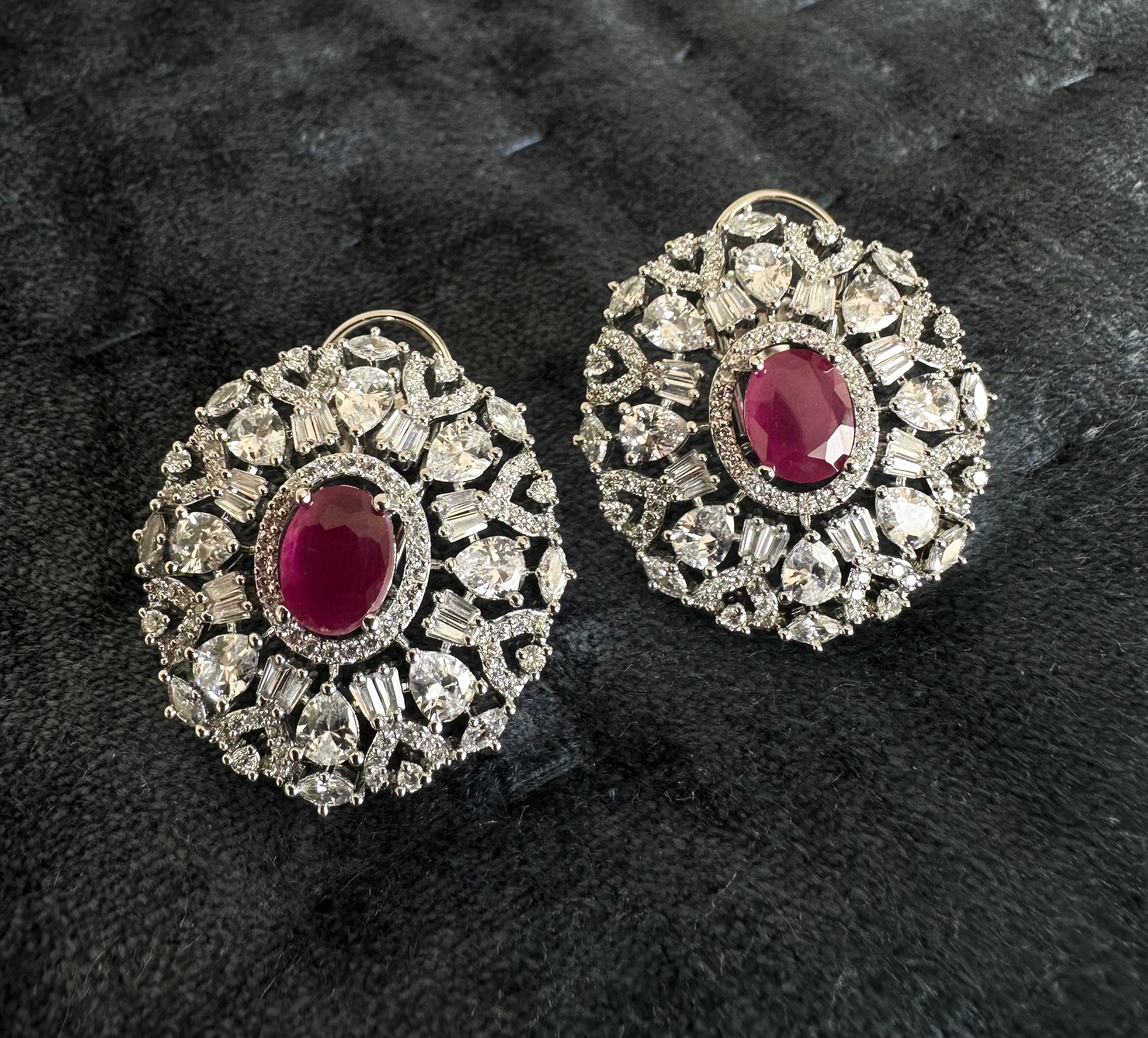 White Diamonds With Red Stone Stud Earrings